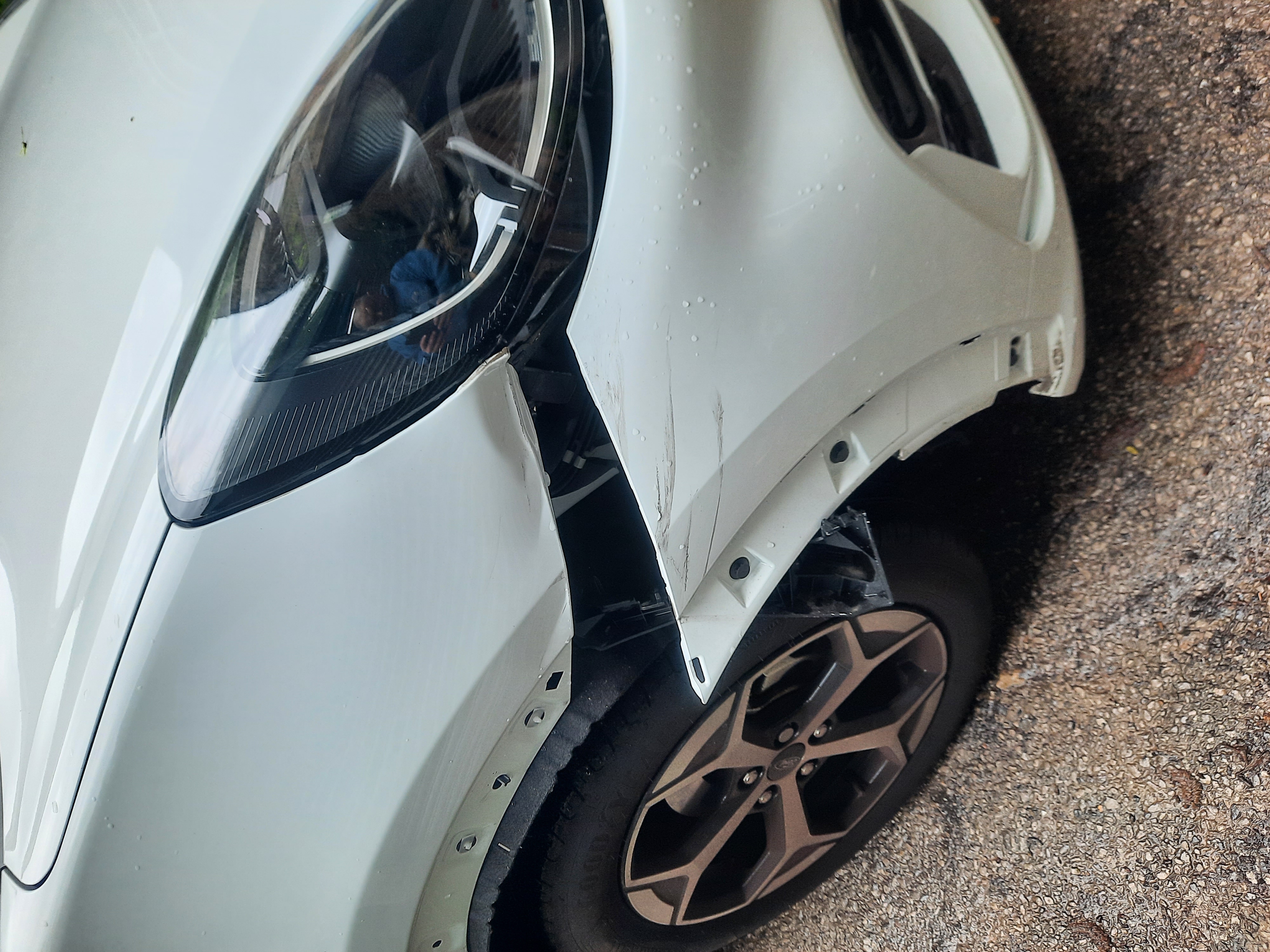 Vehicle front corner undergoing body repair